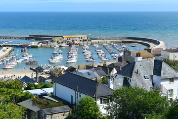Fototapeta na wymiar Lyme Regis was birth place of Sir George Somers who discovered Bermuda the first British Crown Colony He was legal pirate who was allowed to attack ships belonging to countries Britain was at war with