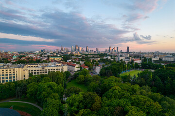 Obraz premium Warsaw at sunset. The capital of Poland is illuminated by a beautiful orange sun.