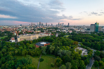 Obraz premium Warsaw at sunset. The capital of Poland is illuminated by a beautiful orange sun.