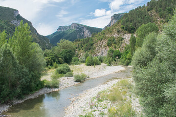 Fototapeta na wymiar The photo shows a natural mountain landscape with a typical village in the north of Navarra, Spain.