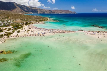 Foto auf Acrylglas Elafonissi Strand, Kreta, Griekenland Aerial view of shallow sandy lagoons and a beach surrounded by deeper dark blue sea (Elafonissi Beach)