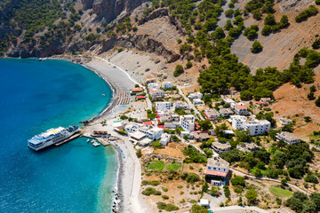 AGIA ROUMELI, CRETE, GREECE - JULY 20 2021: Aerial view of the village of Agia Roumeli at the exit...