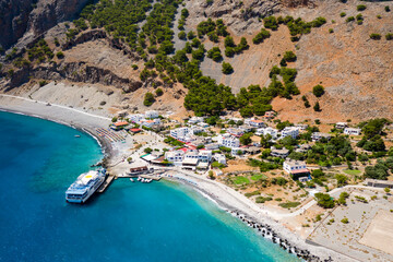 AGIA ROUMELI, CRETE, GREECE - JULY 20 2021: Aerial view of the village of Agia Roumeli at the exit of the Samaria Gorge on the Greek island of Crete.