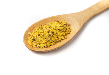 Closeup of lemon pepper seasoning on a wooden spoon isolated over white background