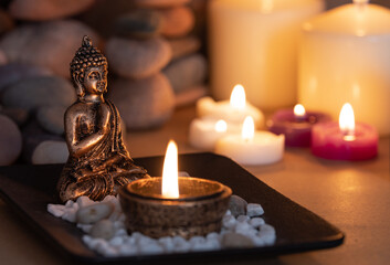 buddha statue with candles for meditation