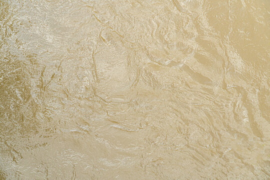 Muddy water, flood, Brown water background, texture of stone