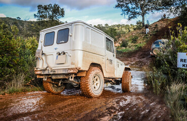 Classic 4x4 vehicle participating in a mud race