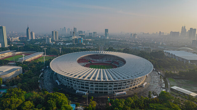 Aerial top down view of the Beautiful scenery of Senayan Stadium. with Jakarta cityscape background. Jakarta, Indonesia, August 3, 2021