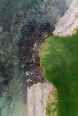 aerial view of land touching the sea