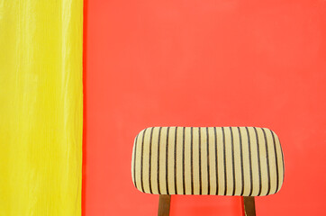 Chair, Yellow Curtain and Red wall