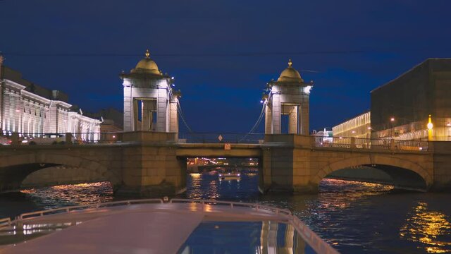 Saint-Petersburg, RUSSIA - May 29 2021, 4k: pleasure craft in Fontanka river, view Lomonosov bridge, on May 29, 2021 in Saint-Petersburg, Russia