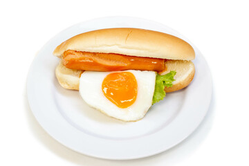 Hot Dog (sausage, fried egg and vegetables) in white plate