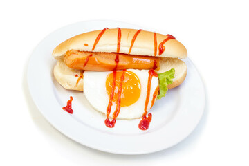 Hot Dog (sausage, fried egg and vegetables) with tomato sauce in white plate