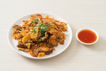 Crispy fried mussel pancake with egg