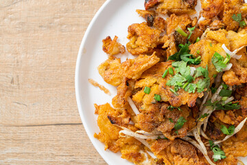 Crispy fried mussel pancake with egg