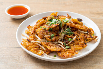 Crispy fried mussel pancake with egg