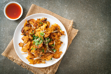 Crispy fried mussel pancake with egg