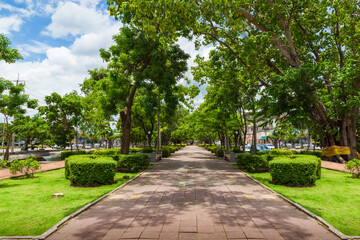 Green park outdoor with blue sky cloud in the city.