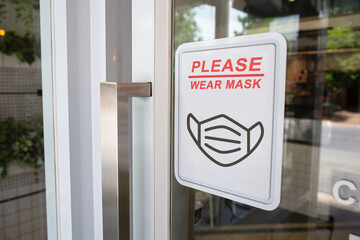 Wear masks, Keep your distance and sign on shop front door when new normal during coronavirus outbreak in the shop for business.