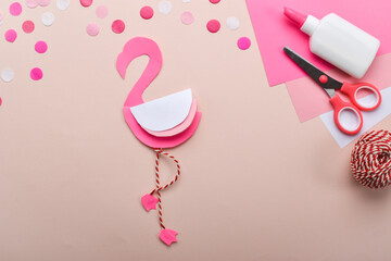 DIY. Children's pink flamingo made of colored paper. Detailed step-by-step instructions.