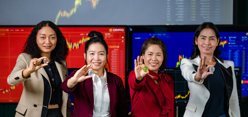 Team of Asian female successful professional broker trader investor stand side by side smiling look...
