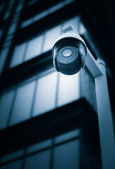  Security surveillance cameras in front of high-rise business district buildings, Shanghai