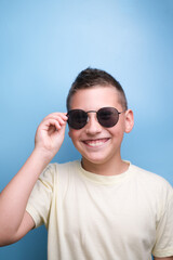 Portrait of Boy in sun glasses , smiling. Emotional face