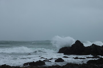 Stormy waves crashing on rocks