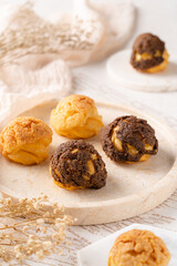 Choux pastry  is a delicate pastry dough used in many pastries. It contains only butter, water, flour, and eggs. Choux pastries are sometimes filled with cream after baking to make cream puffs 