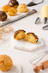 Choux pastry  is a delicate pastry dough used in many pastries. It contains only butter, water, flour, and eggs. Choux pastries are sometimes filled with cream after baking to make cream puffs 