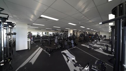 Spacious modern gym interior with many equipments, dolly forward