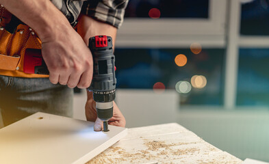 Man working during process of furniture manufacturing