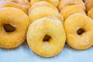 Donuts sprinkled with sugar in a supermarket in Thailand.