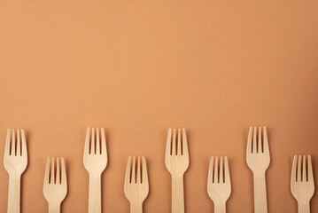 Eco friendly kitchen items . Zero waste and plastic free concept. Forks in top view on beige background. Disposable tableware. Natural products for recycle .