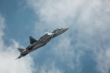 Fototapeta na wymiar Modern tactical jet fighter at the sky