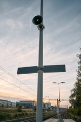 announcement speaker with signs on the train station. concept of transportation in the city.