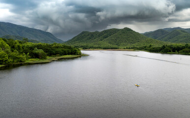 beautiful lake above the dam among blue sky clouds and mountains,lake mountain view