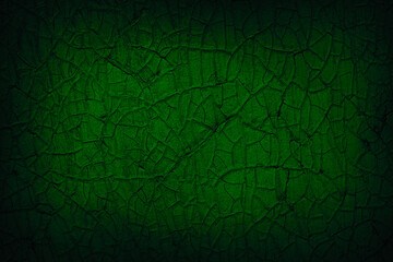 Cracked paint. Dark green grunge background with copy space for design. Web banner.