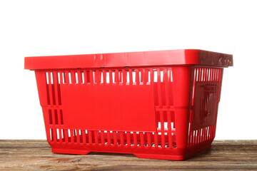 Shopping basket on table against white background