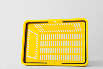 Shopping basket on light background