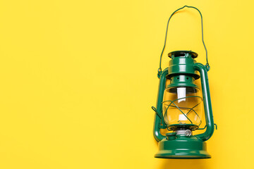 Oil lamp on color background