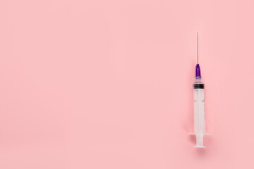 Syringes placed on pink background. Medical concept and vaccination.