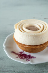 Peach and verbena cake on light green background