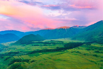 Obraz premium Mountain and forest with grassland natural scenery at sunrise in Hemu Village,Xinjiang,China.