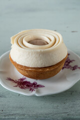 Peach and verbena cake on light green background