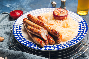 Plate with tasty grilled sausages and sauerkraut on color background, closeup