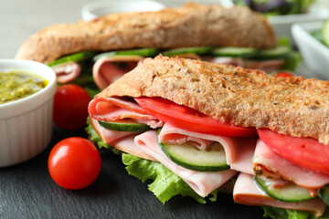 Concept of tasty eating with ciabatta sandwiches, close up