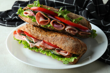 Plate with tasty ciabatta sandwiches, close up