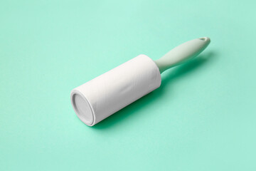 Lint roller on color background