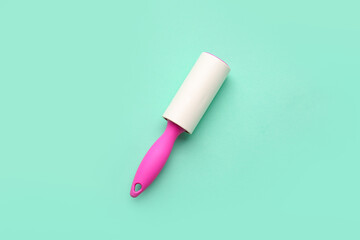 Lint roller on color background
